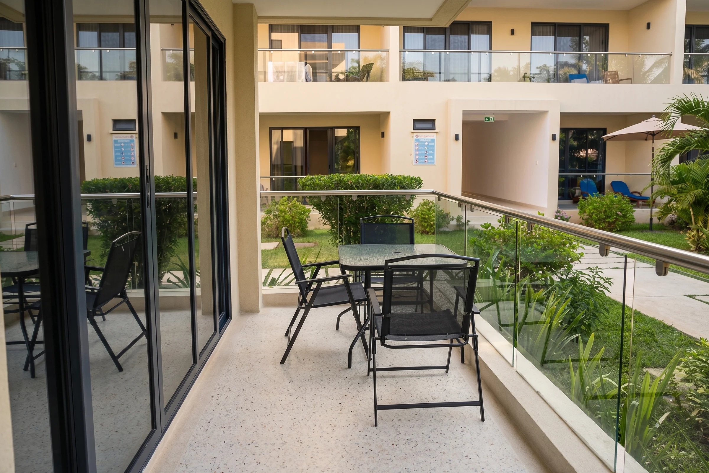 The Sandcastle Apartment - Private ocean breeze balcony lounge overlooking tropical palms